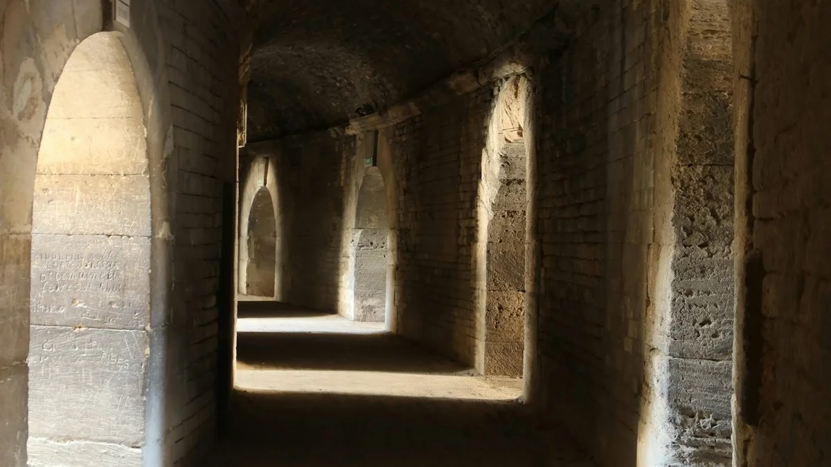 Weathered stone corridor of arches with sunlight pooling on its floor. — a The Obsidian Key guide to Beyond the Basics: Where the Doctrine Goes Next.