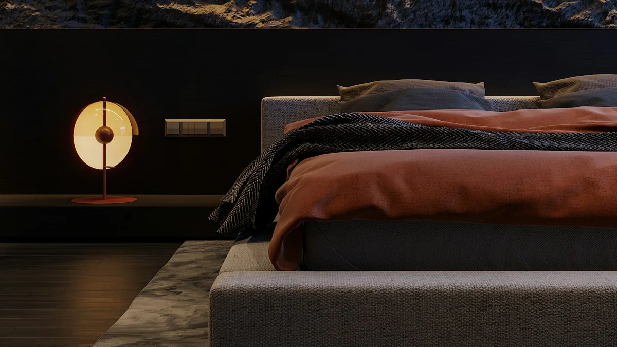 A small round lamp glows on the bedside table beside a low bed in a dark bedroom. — a The Obsidian Key guide to Booking Stillness Into a Full Calendar.