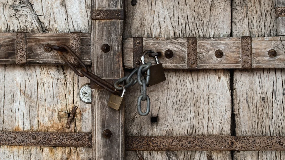 A weathered wooden door is locked shut with a chain and two rusted padlocks. — a The Obsidian Key guide to The Doors the Narrator Could Never Open.