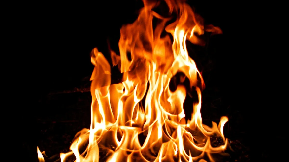 Warm orange fire burning steadily against a pitch-dark background. — a The Obsidian Key guide to Relief Not Excitement: Feeling as Frequency.
