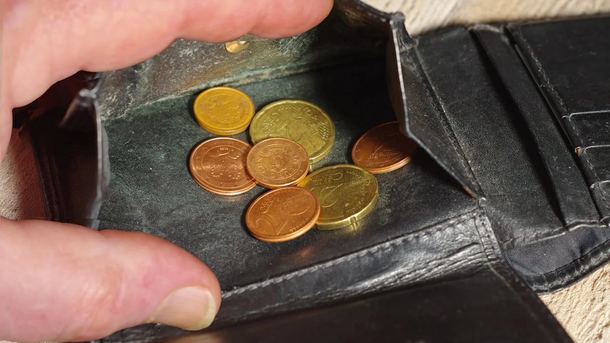 Hand holding open a worn leather wallet with gold and copper coins inside. — a The Obsidian Key guide to Money Mindset According to the Obsidian Key.