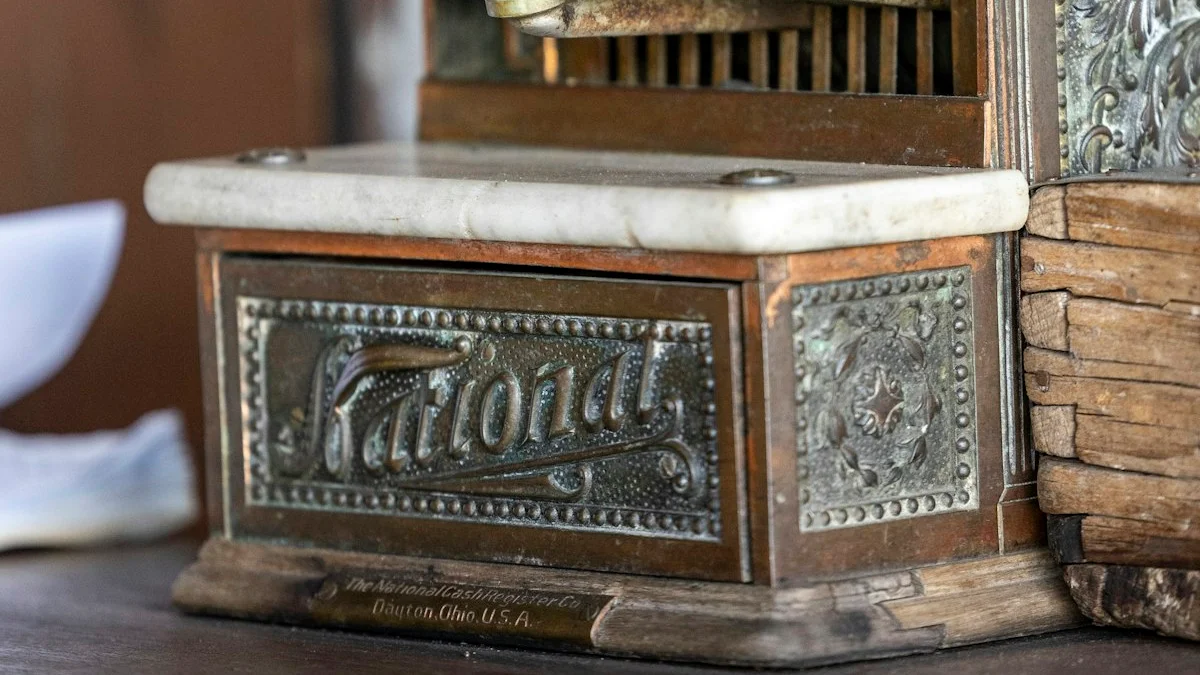 An ornate antique brass cash register with a marble key plate on a wooden counter. — a The Obsidian Key guide to What to Charge: Pricing Your Work Without Apology.