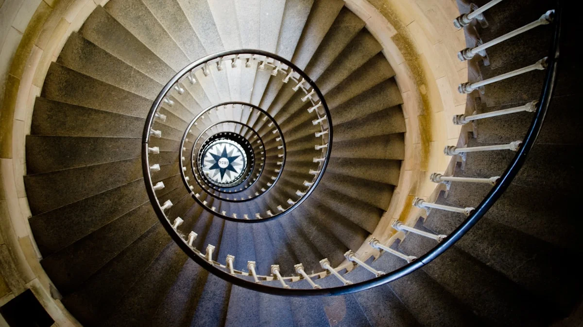 A stone spiral staircase winds downward through tight turning arcs. — a The Obsidian Key guide to Reality Architecture Self-Check: Five Readings to Take.