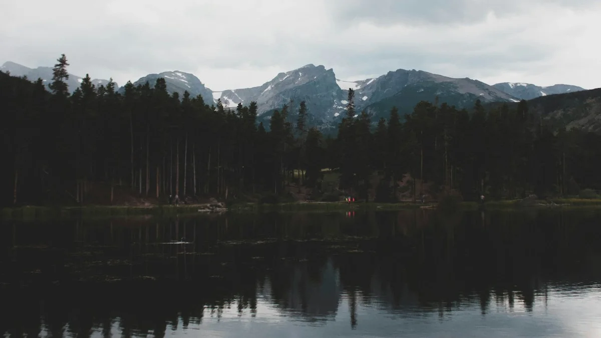 Dark still water holds the reflection of a forested mountain shore. — a The Obsidian Key guide to Sealing or Shielding: Containment vs Sovereignty.