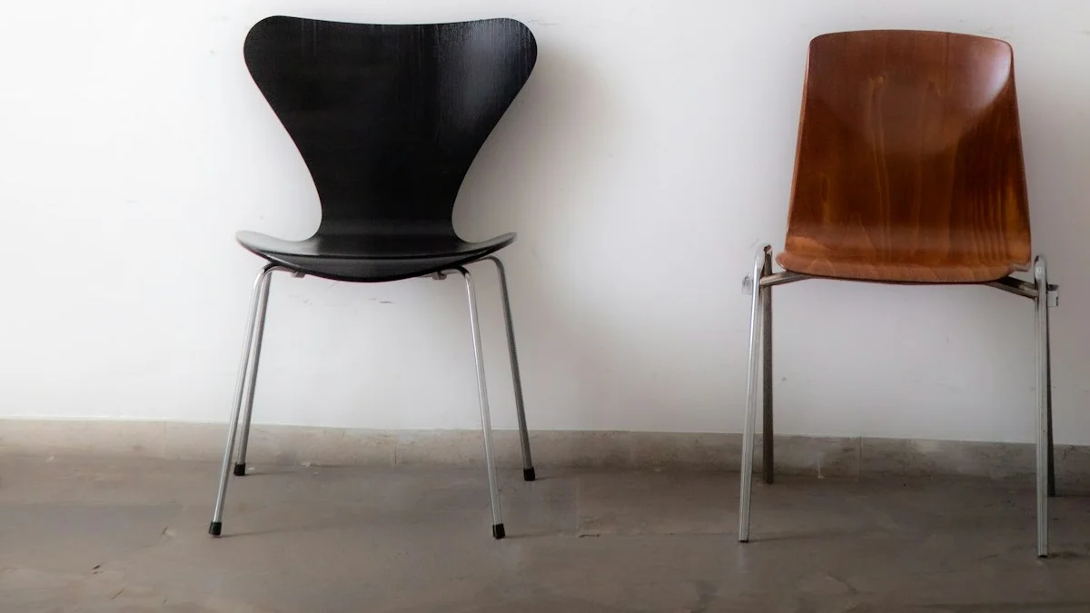 A black chair and a brown wooden chair stand side by side against a plain white wall. — a The Obsidian Key guide to How Your Signal Shapes the People Around You.