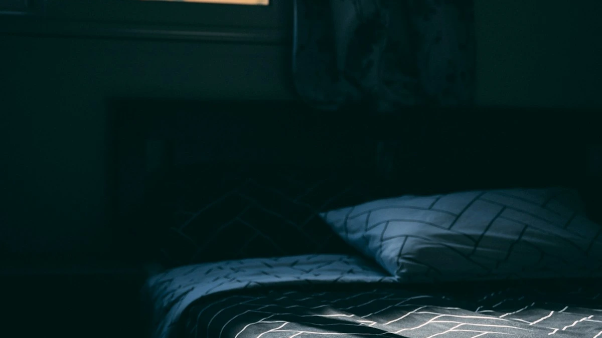 An empty bed with linen sheets in a dim moonlit bedroom. — a The Obsidian Key guide to Fall Asleep Inside the Assumed State.