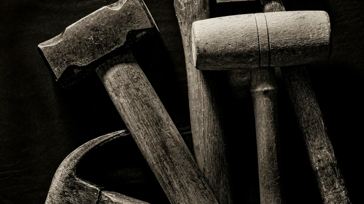 Old wooden-handled hammers laid out on a dark workshop bench. — a The Obsidian Key guide to The Closed Circuit: Sealed Attention Defined.