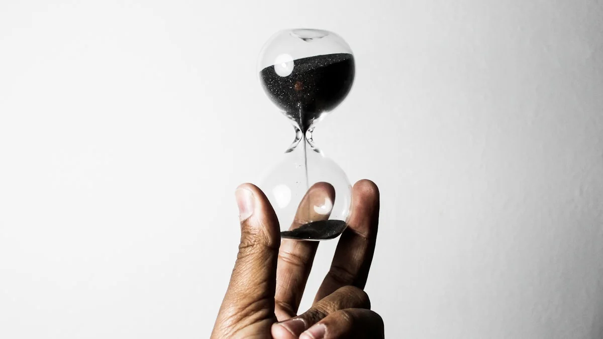 A hand holds a glass hourglass with black sand running through its narrow neck. — a The Obsidian Key guide to The Weekly Audit Routine: Twenty Minutes Three Lists.